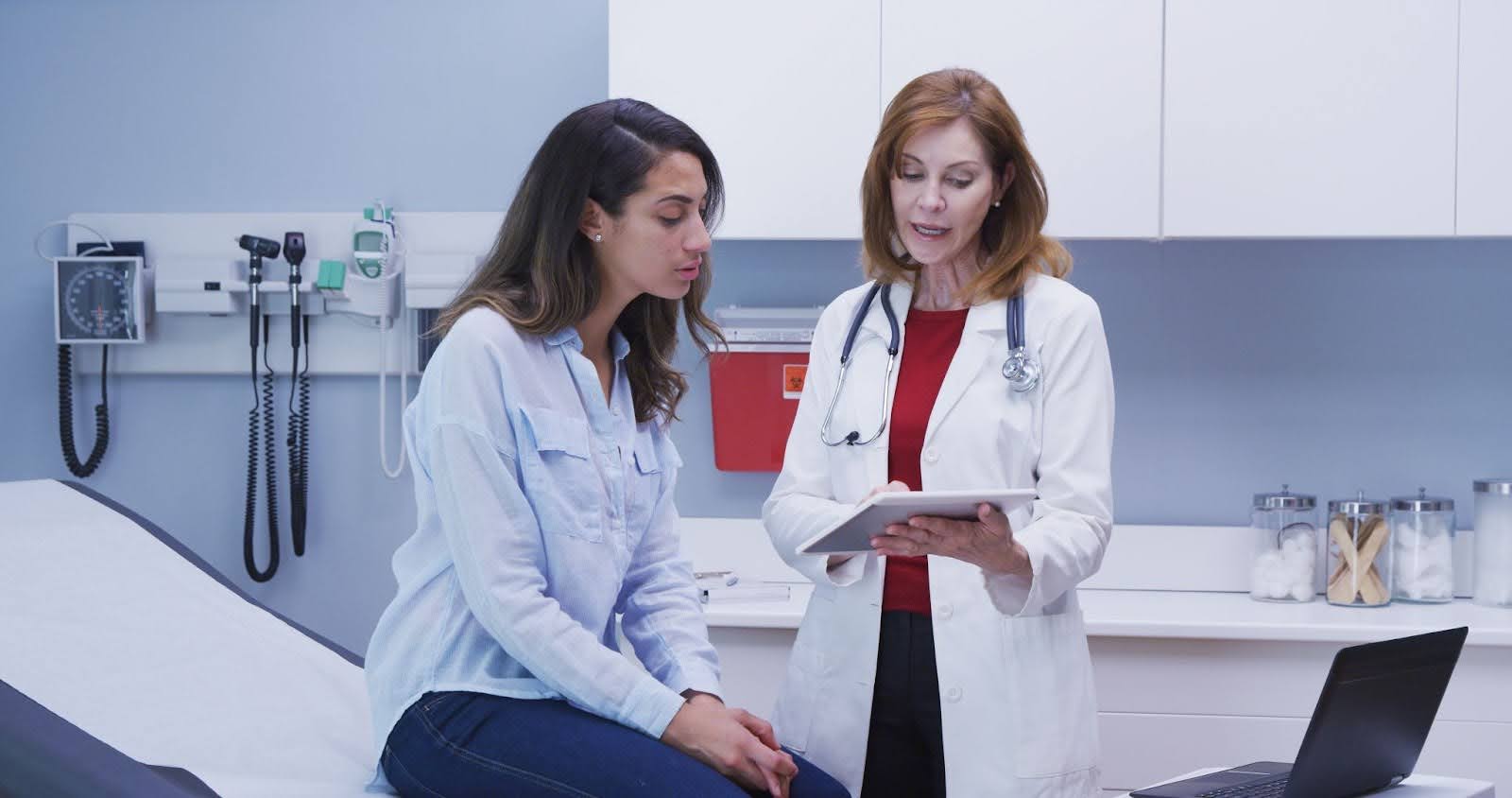 woman consulting a doctor about ovarian cancer symptoms